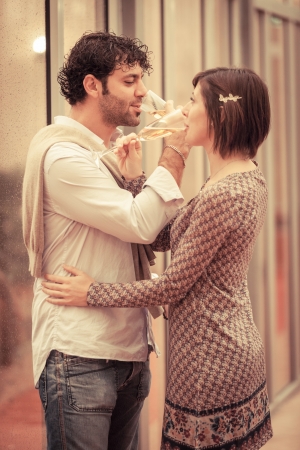 Romantic Young Couple Toasting and Drinkingの写真素材