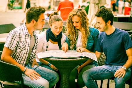 Group of Tourists Looking at Mapの写真素材