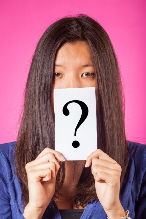 Doubtful Chinese Woman holding Question Markの写真素材