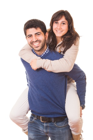 Young Man Giving a Piggyback to His Girlfriendの写真素材