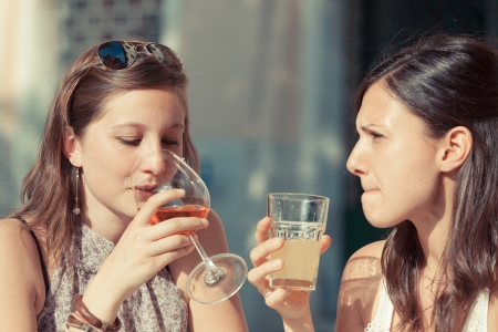 Two Young Women with a Cold Drinkの写真素材