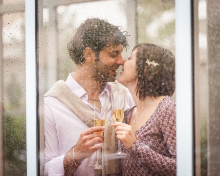Romantic Young Couple Toasting and Drinkingの写真素材