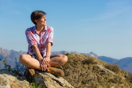 Young Woman at Top of Mountainの写真素材