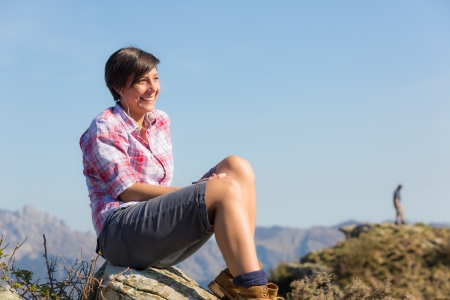 Young Woman at Top of Mountainの写真素材