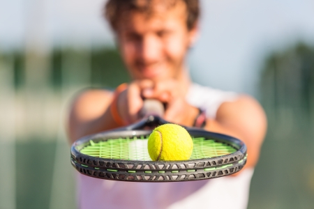 Young Man Playing Tennisの写真素材