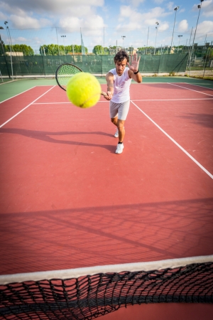 Young Man Playing Tennisの写真素材