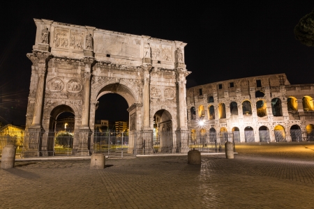 Colosseum and Arch of Triumph in Rome at Nightの写真素材