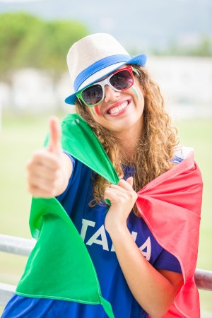 Italian Girl Supporter at Stadiumの写真素材
