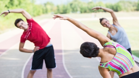 Group of People doing Stretching Exercisesの写真素材