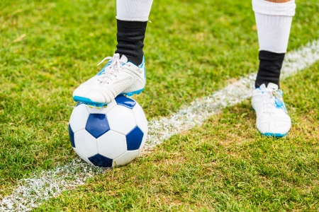 Soccer Ball and Player Foot