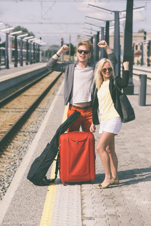 Young Couple Waiting at Train Stationの写真素材