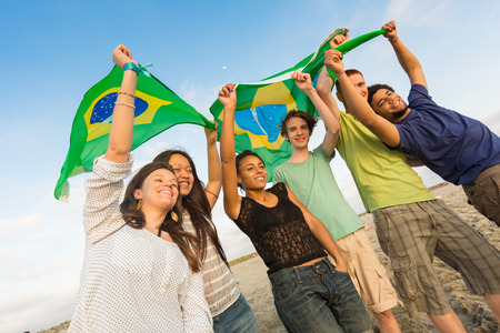 Group of Friends with Brazilian Flag at Beachの写真素材