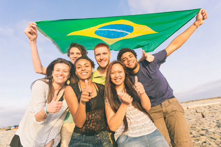 Group of Friends with Brazilian Flag at Beachの写真素材