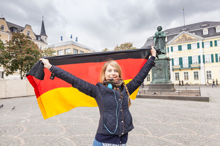 German Girl with Flag in Bonn Main Squareの写真素材