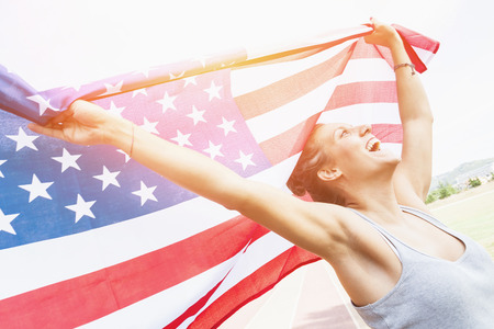 Beautiful Young Woman with USA Flagの写真素材