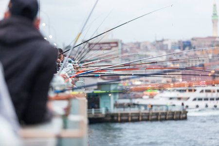 Fishing poles on Galata Bridge in Istanbulの写真素材