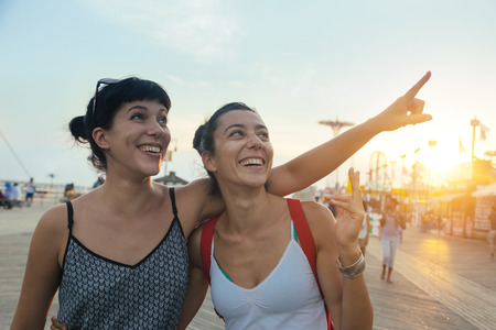 Beautiful Young Women in Coney Island at Sunsetの写真素材