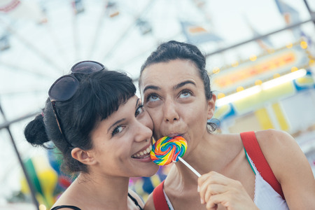 Happy Young Women eating Lollipopの写真素材