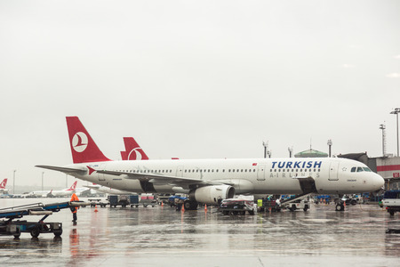 ISTANBUL, TURKEY - OCTOBER 30, 2014: Turkish Airlines airplanes Airbus A321 at Ataturk Airport on a rainy day.のeditorial素材