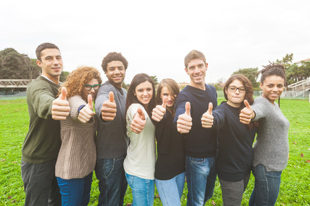 Multiethnic Group of Friends with Thumbs Upの写真素材