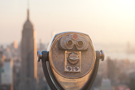 Binocular with New York Skyscrapers on Background at Sunset