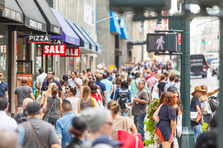 NEW YORK, USA - AUGUST 28, 2014: Crowded sidewalk on 5th Avenue with tourists and commuters on a sunny day.のeditorial素材
