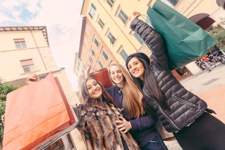 Happy Women with Shopping Bags in the Cityの写真素材
