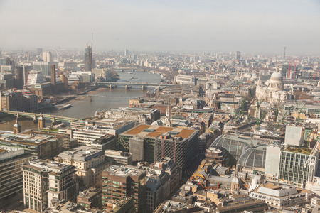 London aerial view with Thames and St Paul cathedral. On the left side of the photo there are also the Millennium Wheel and the Big Ben.の写真素材