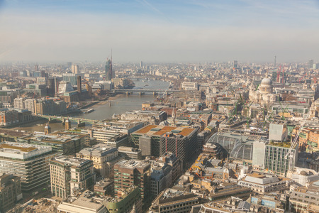 London aerial view with Thames and St Paul cathedral. On the left side of the photo there are also the Millennium Wheel and the Big Ben.の写真素材