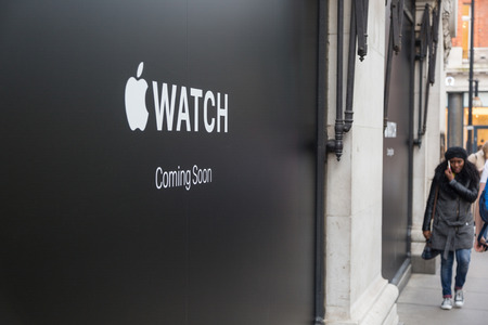 LONDON, UK - APRIL 08, 2015: Apple Watch store sign at Selfridges in Oxford street with people walking on sidewalk. It will be one of first three official stores in the world, opening on April 10th.のeditorial素材