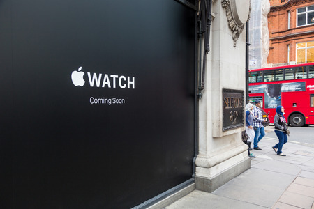 LONDON, UK - APRIL 08, 2015: Apple Watch store sign at Selfridges in Oxford street with people walking on sidewalk. It will be one of first three official stores in the world, opening on April 10th.のeditorial素材