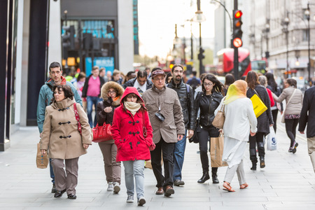 LONDON, UNITED KINGDOM - APRIL 17, 2015: Crowded sidewalk on Oxford Street with commuters and tourists from all over the world.のeditorial素材