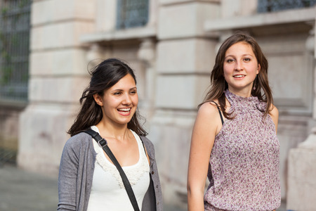 Two Young Women Walking in the Cityの写真素材