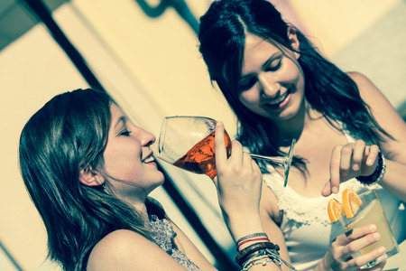 Two Young Women with a Cold Drinkの写真素材