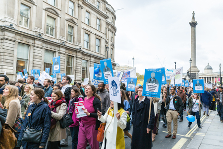 LONDON, UK - OCTOBER 17, 2015: Thousands Junior doctors marching in London streets to campaign against NHS contract changesのeditorial素材
