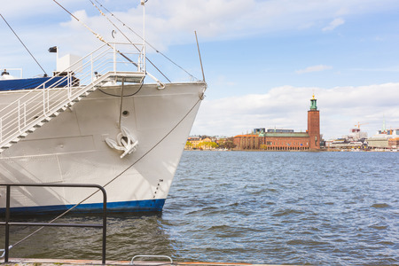 Stockholm view with a bow and town hall on background. Travel concept with these two symbols of the capital city of Sweden.の写真素材