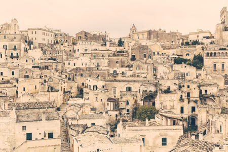 Old town of Matera, capital city of Basilicata county in Italy. It is famous worldwide for its sassi, typical houses with prehistorical origins. Architecture and travel concepts. Vintage filter addedの写真素材