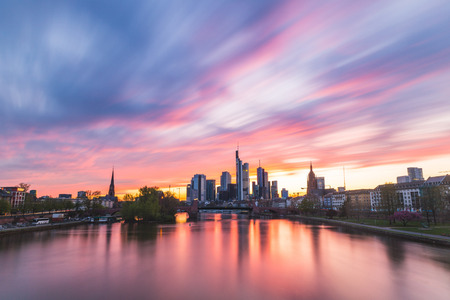 Frankfurt skyline and Main river at sunset. Long exposure shot with a dreamy effect on the clouds. Real colors with no manipulations. Travel and architecture conceptsの写真素材
