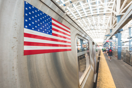 United States flag on a subway train in New York.の写真素材