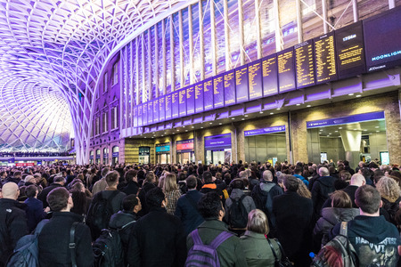 LONDON, UK - FEBRUARY 23, 2017: Crowded Kings Cross station in the city. Hundreds people waiting for the train, with delays and cancellations as Storm Doris lashes UKのeditorial素材