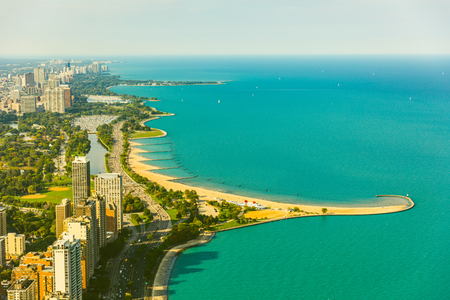 Chicago lakeside aerial view, toned image. Vintage coloured photo of buildings and highway next to the lake Michigan. Photo from helicopter in Chicago. Summer and travel conceptsの写真素材