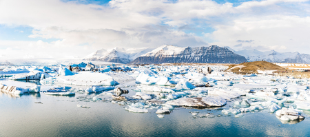 jokulsarlon glacier lagoon with iceberg floating and mountains on background. Beautiful view of this lake in the Vatnajokull area. Nature and travel concepts.の写真素材