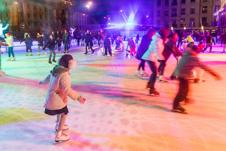 MUNICH, GERMANY - DECEMBER 11, 2016: People ice skating in Karlsplatz. On Christmas time a large ice rink is available during day and evening in the famous square of the cityのeditorial素材