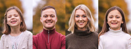 Composition of portraits with man, woman and two girls - Family with father, mother and two daughters looking at camera and smiling with autumn colours on backgroundの写真素材