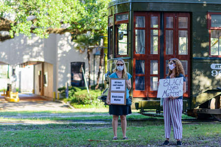 New Orleans, Louisiana/USA - 6/12/2020: Demonstrators for Black Lives Matter on Carrollton Avenue with streetcar in backgroundのeditorial素材