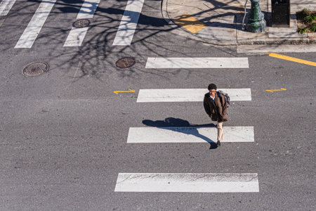 NEW ORLEANS, LA - FEBRUARY 7, 2020: Woman crossing a downtown street in New Orleansのeditorial素材