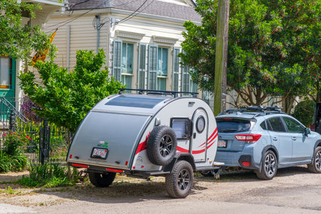 NEW ORLEANS, LA, USA - APRIL 4, 2023:  Nucamp TAG miniature camper trailer attached to parked car in...