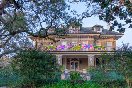 NEW ORLEANS, LA, USA - FEBRUARY 9, 2021: Historic mansion on St. Charles Avenue with mask and flower decorations for Mardi Grasのeditorial素材