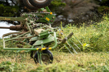 Making and growing hay and silage in Australia. with tractors and machinery in a cattle farm during summer.の写真素材