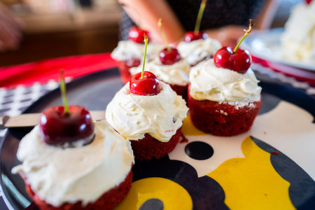 cherry cupcakes for dessert ast christmas timeの写真素材